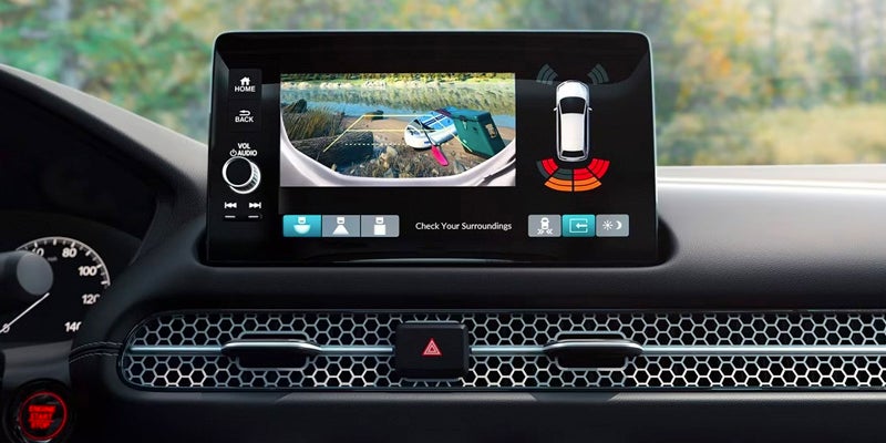 A photo of a Honda touchscreen showing the rear backup camera and backup sensor funcitons.