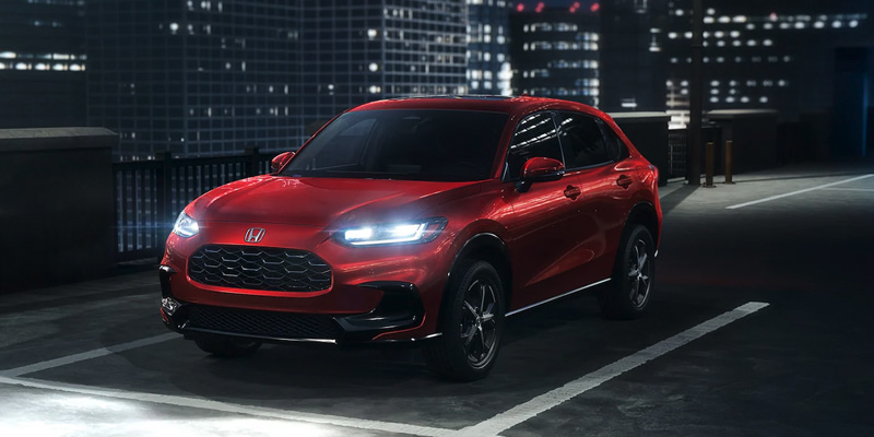 A photo of a red 2025 Honda HR-V at night.