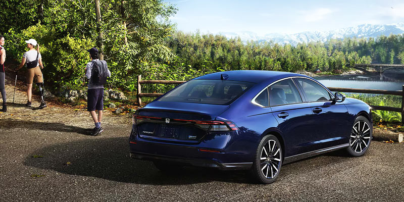 A photo of a blue 2025 Honda Accord parked on a hilltop